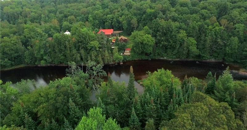 Scandinave Spa Mont-Tremblant Nordic spa nestled in the forest by the river in the summer